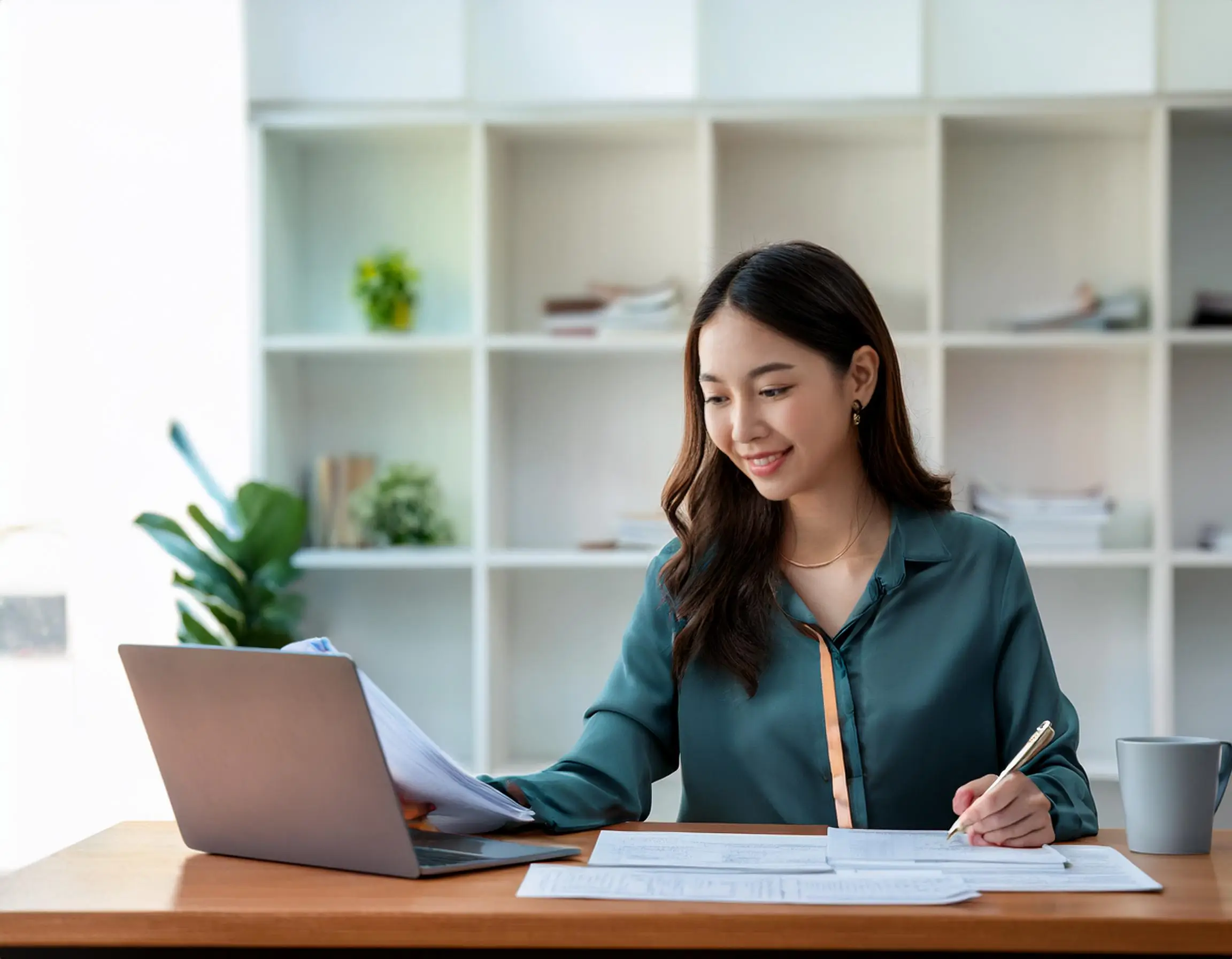 Ontario sales tax exemption for students Firefly A young woman filling out application forms on her laptop with documents like a student ID 2